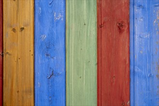 Shuttering made of coloured wooden boards as background or texture