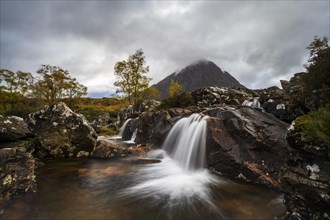 Waterfall in Autumn Landscape