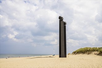 The sculpture The Three White Noses on the beach of De Panne
