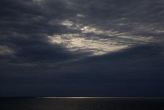 Dark clouds and sunlight over the North Sea
