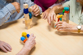 Top view of a table of a nursing home with people playing with skill games