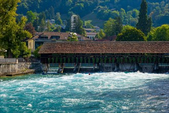 Beautiful Obere Schleuse Bridge in City of Thun and a Kayak in a Sunny Summer Day
