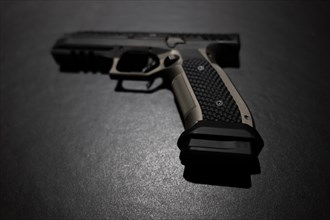 Modern Elegant Handgun on Grey Background in Switzerland
