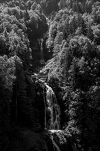 The Giessbach Waterfall on the Mountain Side with Sunlight in Brienz