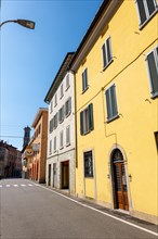 City Street in Porto Ceresio and Church Tower in a Sunny Summer Day in Porto Ceresio