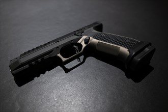 Modern Elegant Handgun on Grey Background in Switzerland