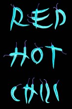 Red chilli peppers arranged to spell out RED HOT CHILI