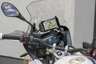 Modern cockpit of a BMW motorbike with screen and navigation system
