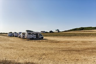 Various motorhomes and campervans on a car park
