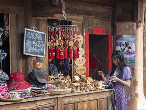 Souvenir shop in front of old wooden house