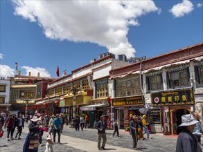 Pilgrims walk through the streets of Lhasa