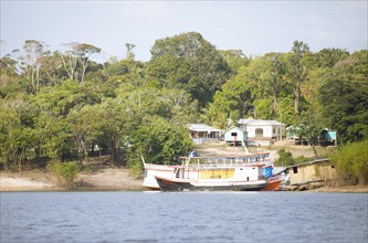 Boats and settlement on the banks of the Rio Amazonas at low water level