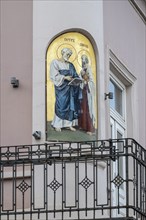 Image of a saint on a house in the old town