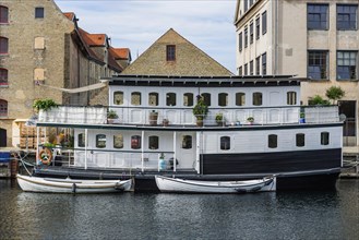 Boats and houseboat in a canal of Copenhagen