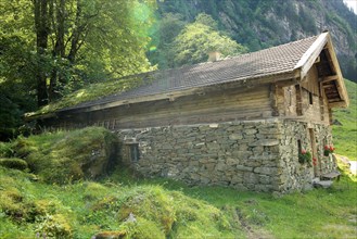 Alpine hut made of stone and wood in Pinzgau