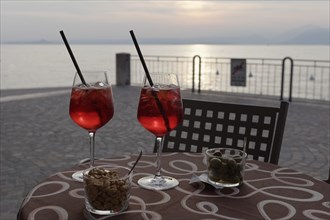 Two sundowners Campari Sprizz on a table on the waterfront
