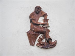 Man sitting at a potter's pane