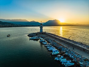 Sunrise over Lighthouse and Marina from a drone