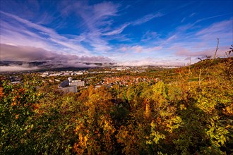 View of Jena in autumn in the morning with rising fog and blue sky