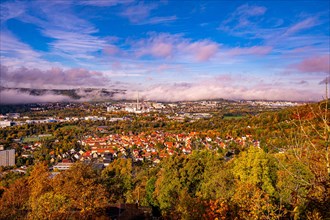 View of Jena in autumn in the morning with rising fog and blue sky