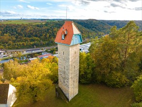 Historic tower in the autumn forest