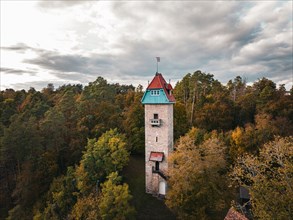 Historic tower in the autumn forest