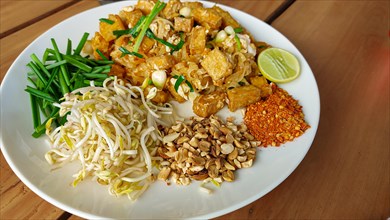 Overhead view of a plate of tofu pad thai