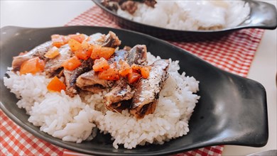 Ginisang sardinas or sauteed sardines with tomatoes paired with rice
