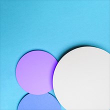 Abstract circles with drop shadows blue background design