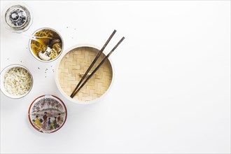 Asian dishes near chopsticks
