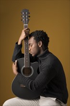 Black boy playing guitar