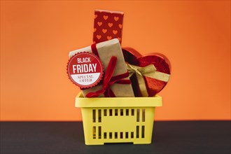 Black friday decoration with gifts shopping basket