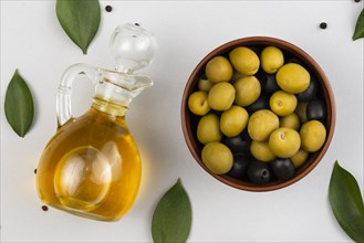 Bowl with olives olives oil bottle