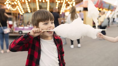 Boy enjoying cotton candy