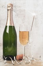 Close up champagne bottle with glasses