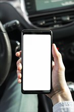 Close up person showing mobile phone car