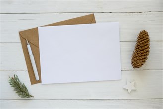 Copy space card with envelope christmas pine needles cone