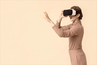 Copy space woman playing virtual reality headset