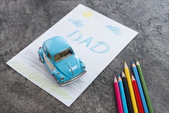 Dad inscription with toy car pencils
