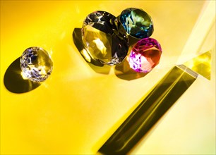 Different types diamonds yellow background