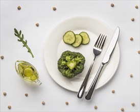 Flat lay fresh broccoli plate with cutlery