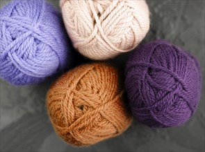 Flat lay orange purple wool yarn
