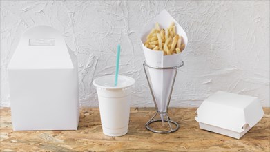 French fries disposal cup packages wooden desk