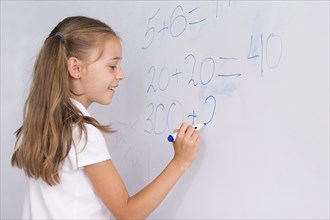 Girl doing math whiteboard