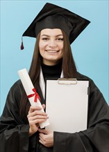 Girl holding clipboard diploma