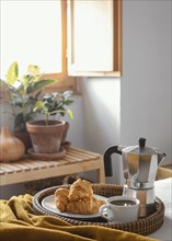 High angle coffee cup croissants