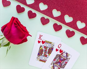 King queen hearts playing cards with rose