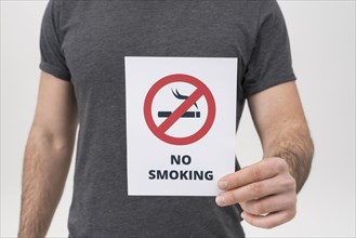 Mid section man showing no smoking sign isolated white backdrop