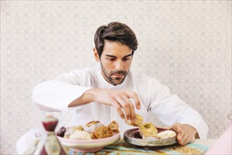 Muslim man eating arab food