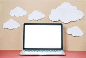 Paper clouds laptop
